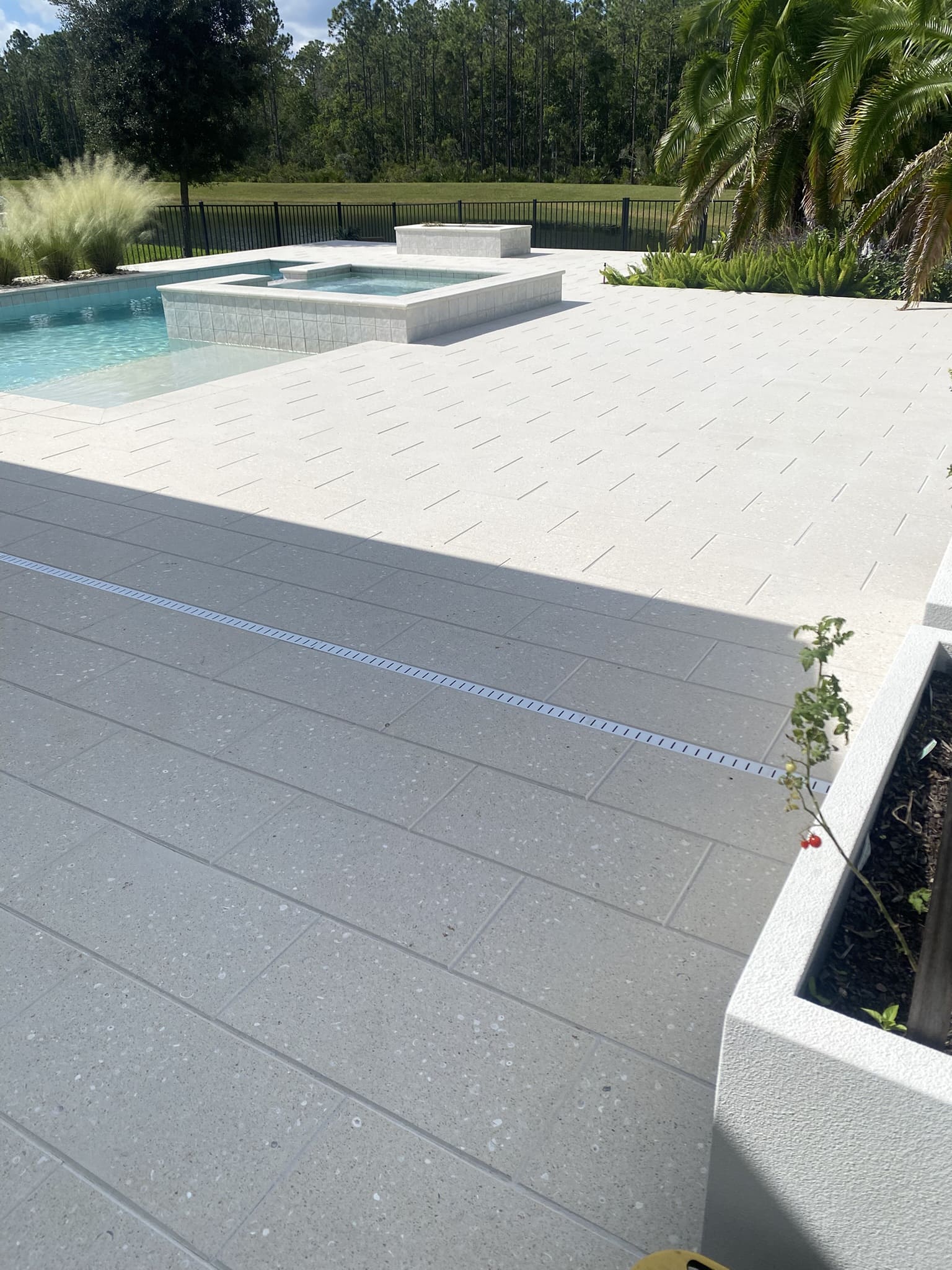 Beachwalk pavers restored and sealed near the pool and patio